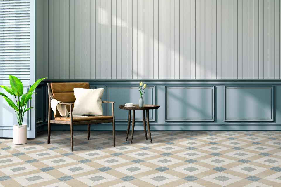 bold colored geometric tiles in entry space with leather chair and blue accents